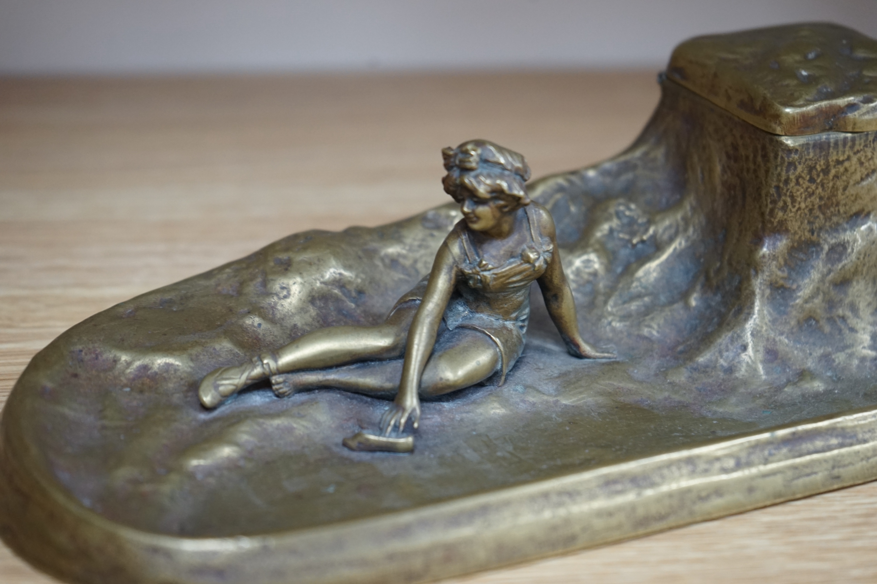 An Art Nouveau bronze ‘bathing lady’ inkwell, 26cm wide. Condition - good